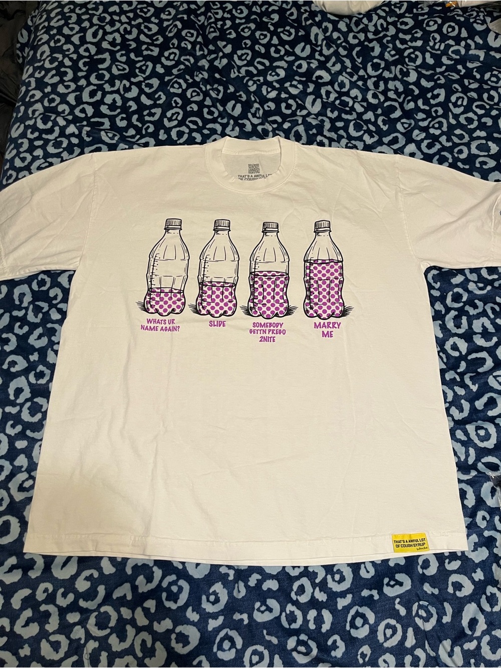 White Short-Sleeve Graphic Tee with Pink Bottle Print